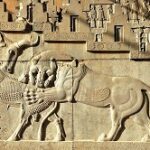The bas-relief of a lion attacking a bull at Persepolis, dating back approximately 2,500 years.